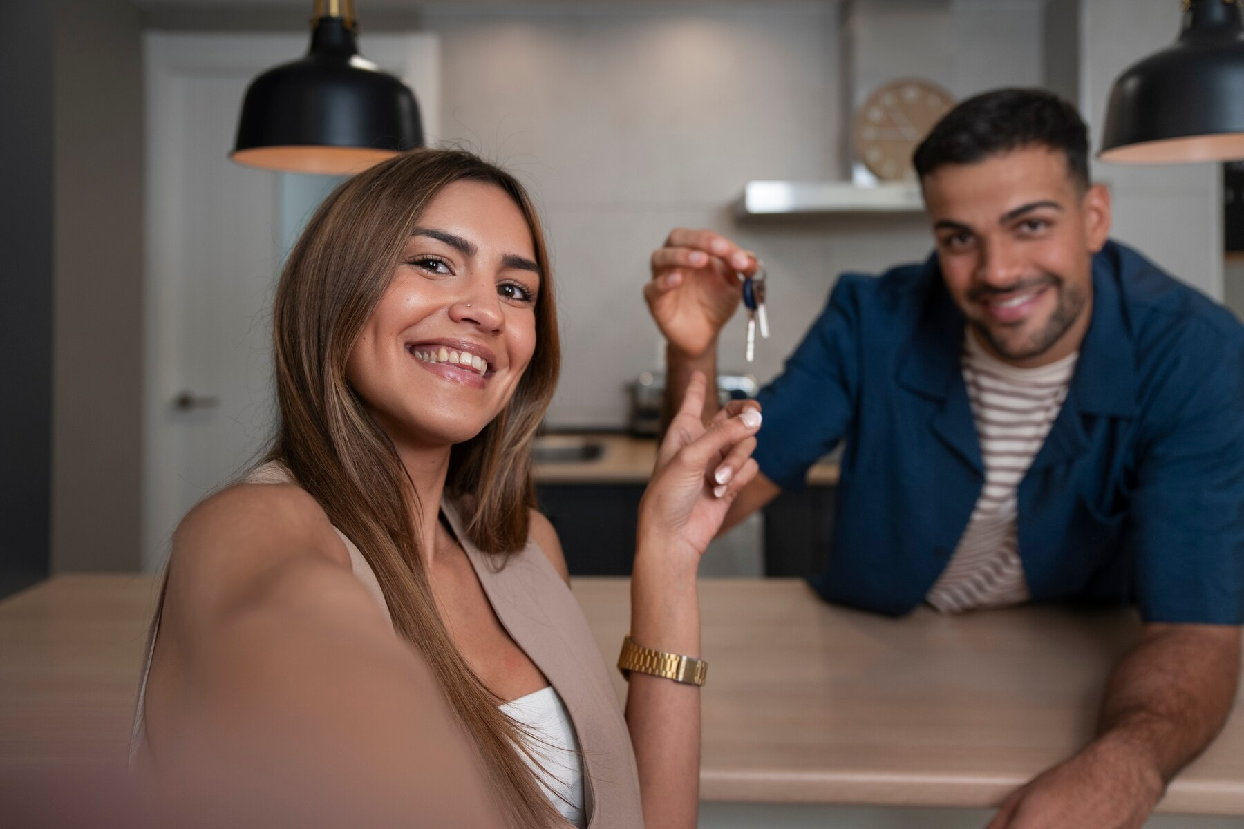 Happy couple with keys